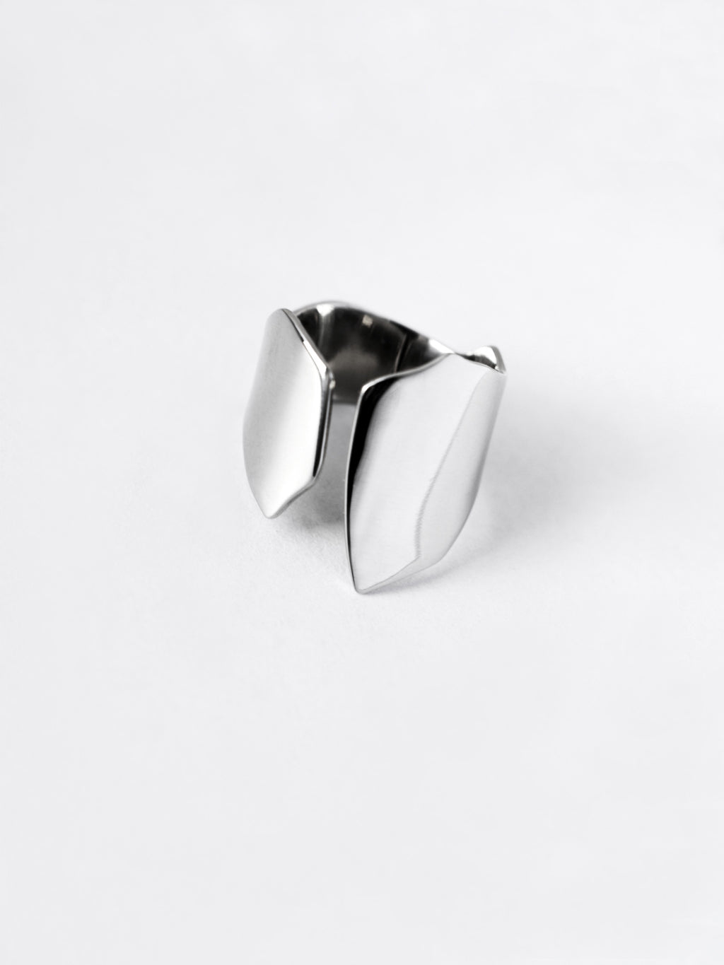 Adjustable sculptural silver ring on a white background