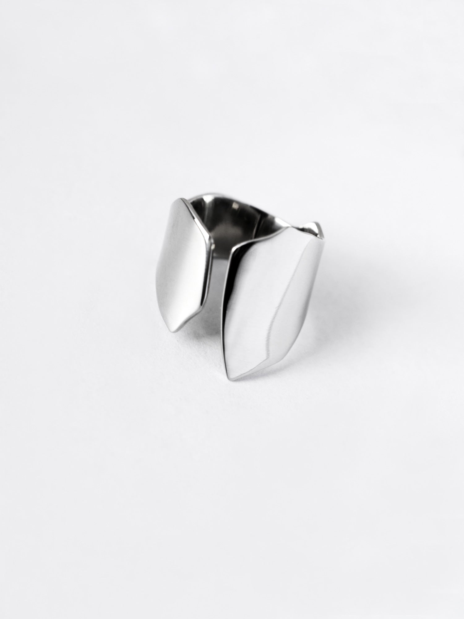 Adjustable sculptural silver ring on a white background