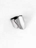 Adjustable sculptural silver ring on a white background
