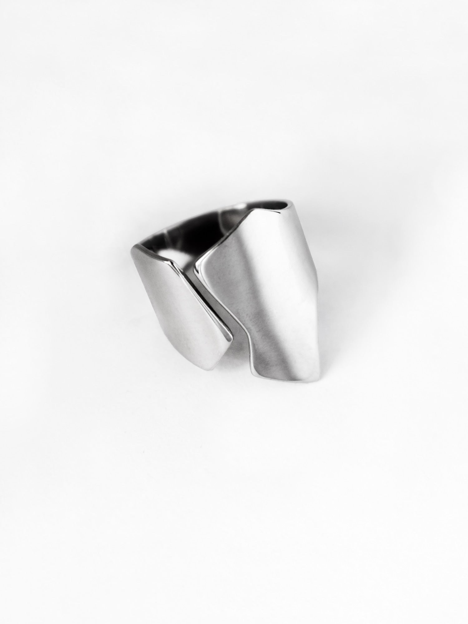 Adjustable sculptural silver ring on a white background