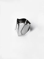 Adjustable sculptural silver ring on a white background