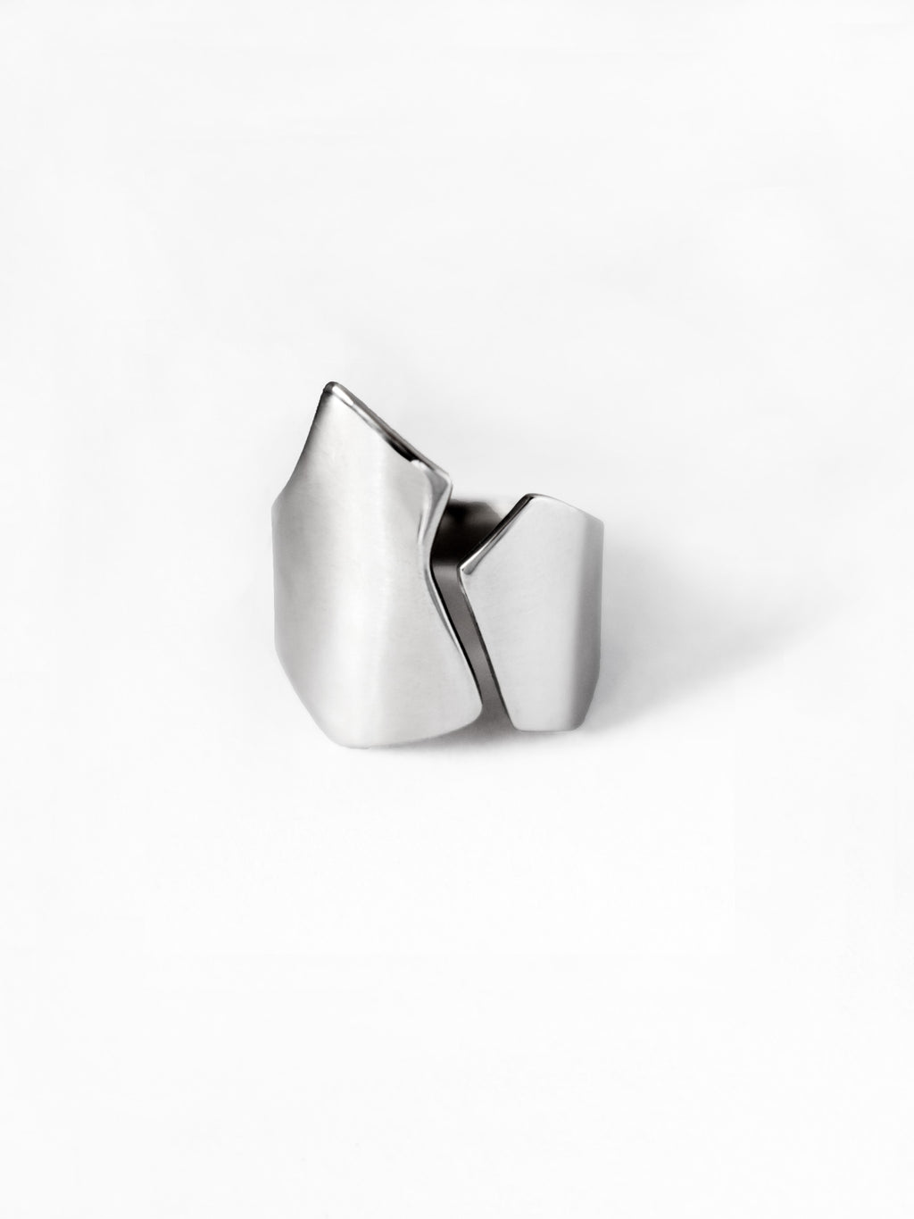 Adjustable sculptural silver ring on a white background