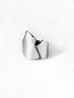 Adjustable sculptural silver ring on a white background