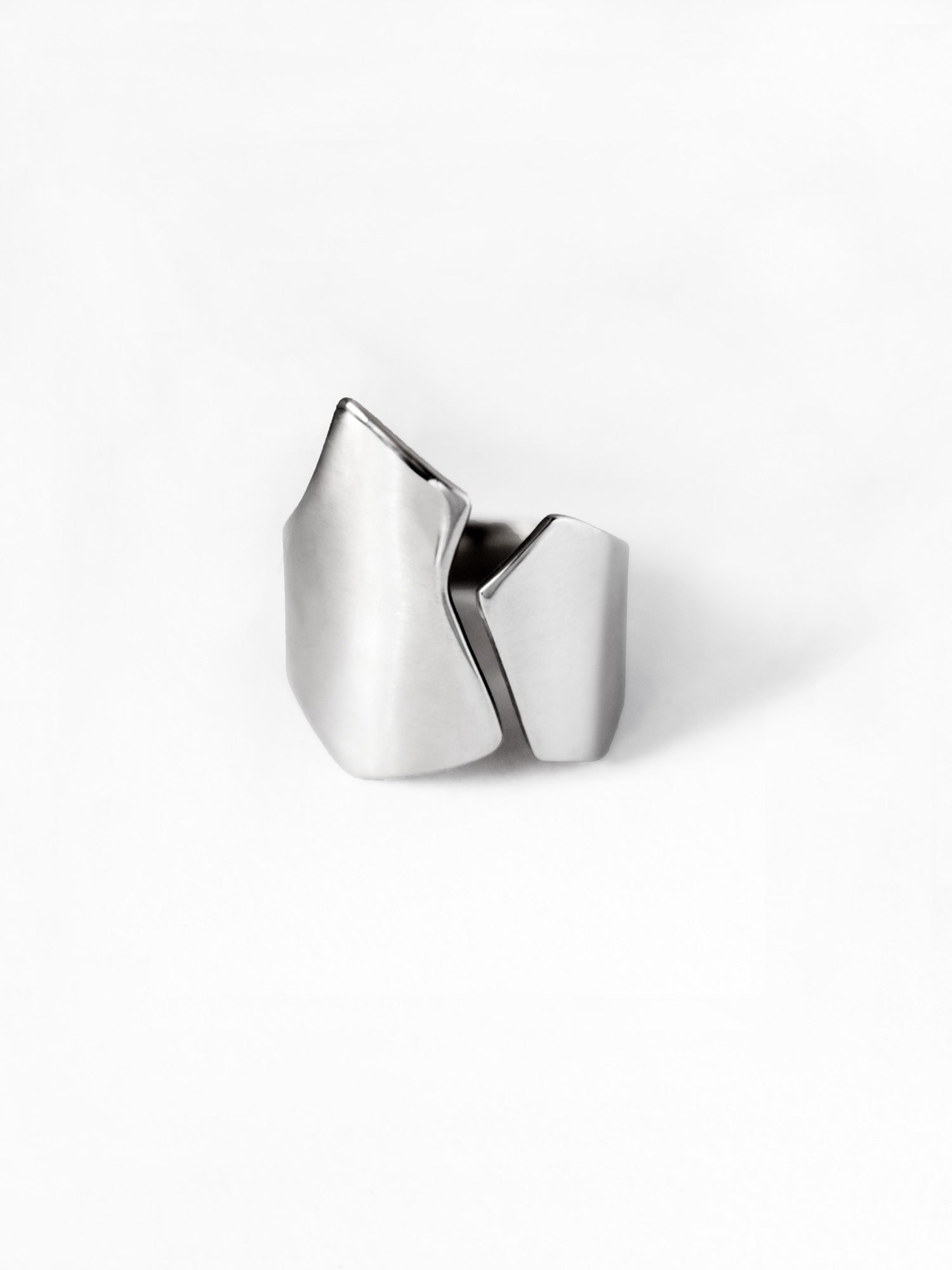Adjustable sculptural silver ring on a white background