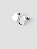 Pair of small organic-shaped silver stud earrings on a light gray background