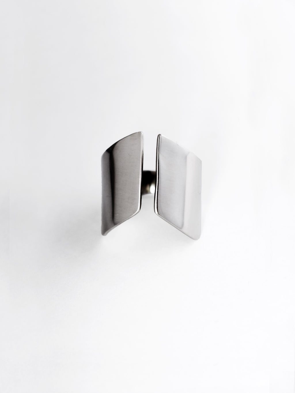 Adjustable sculptural silver ring on a white background