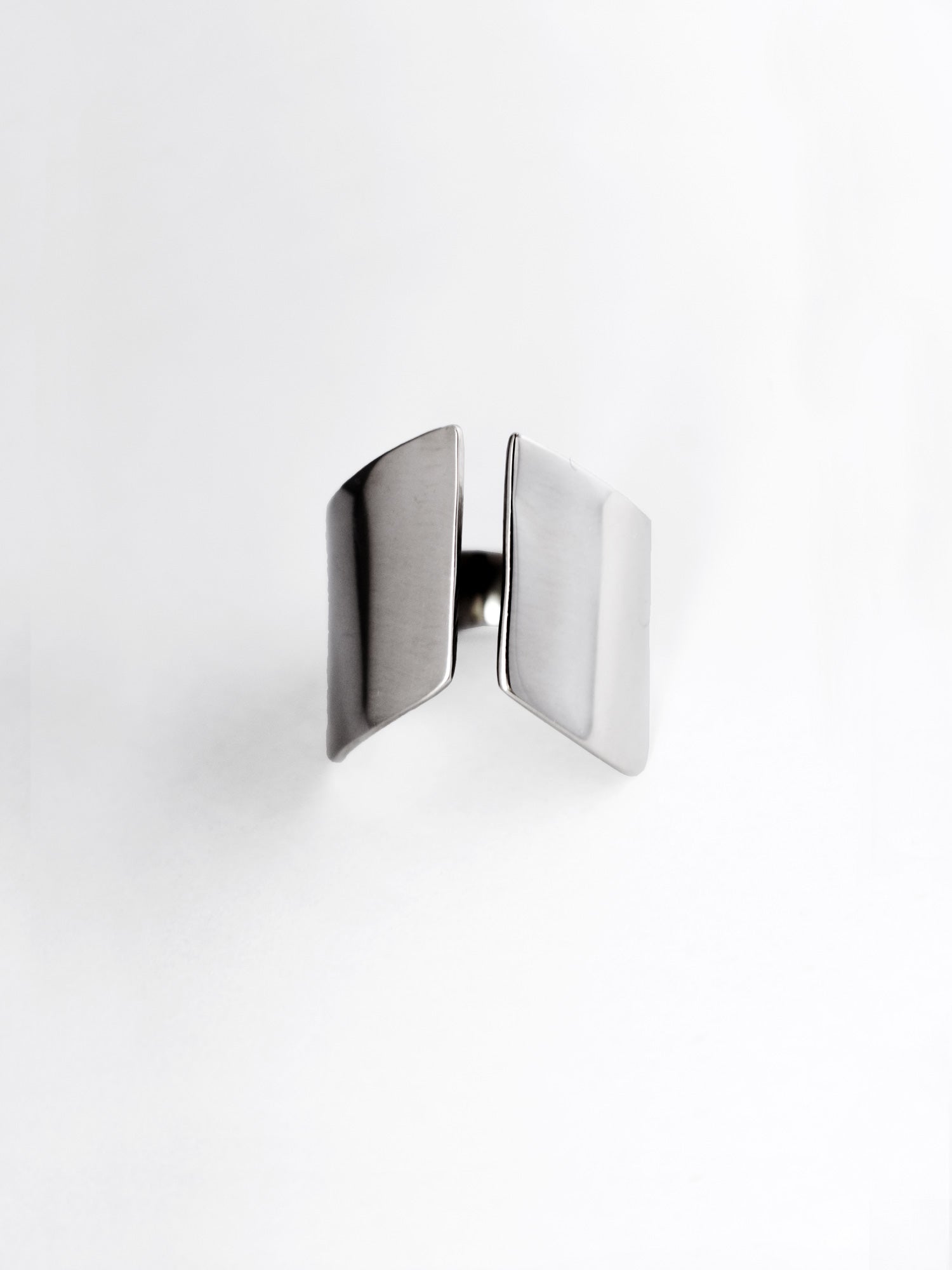 Adjustable sculptural silver ring on a white background
