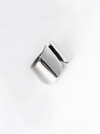 Adjustable sculptural silver ring on a white background
